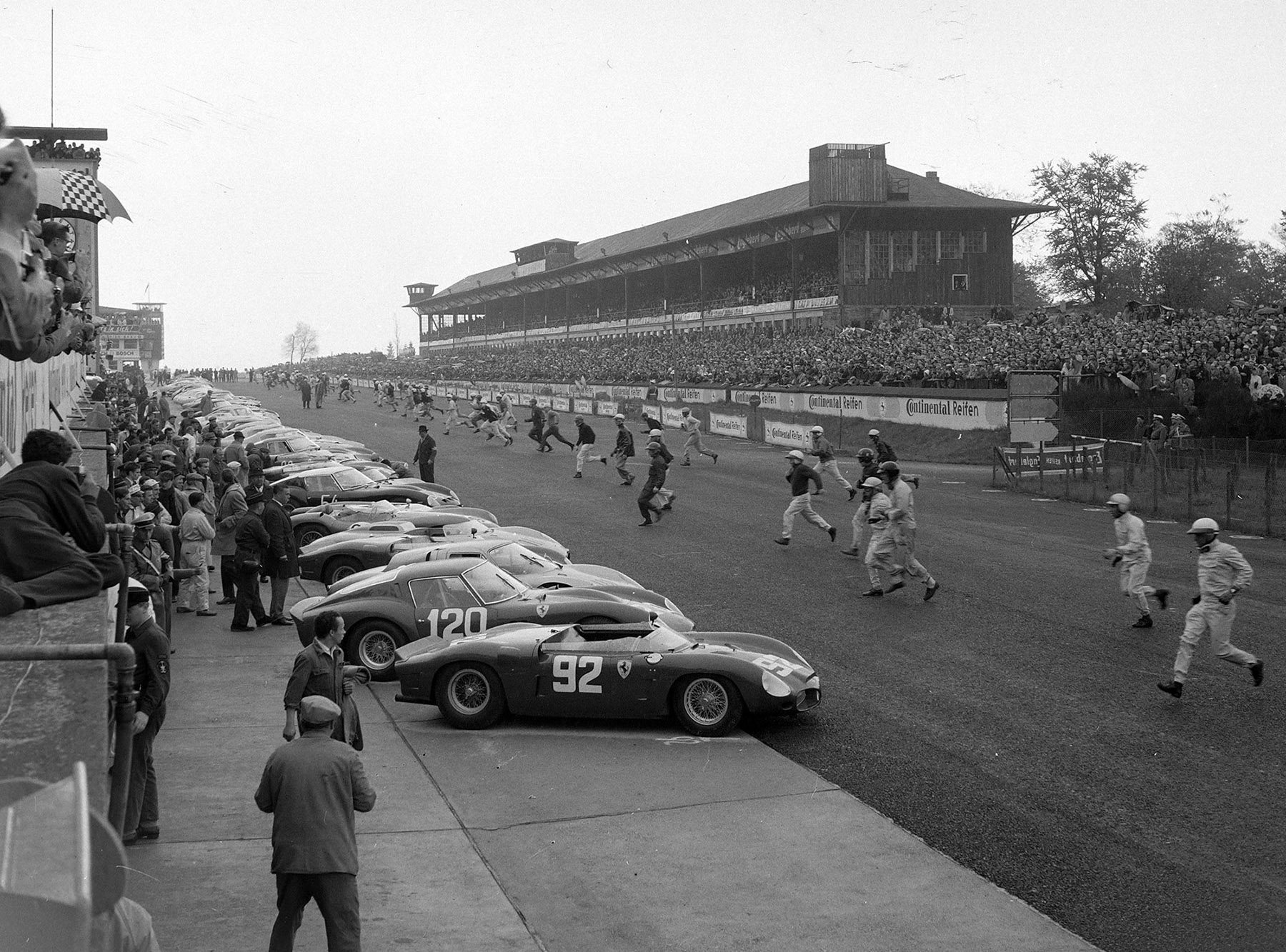 Drivers run to their cars at the start during the Nürburgring 1000 kms at Nürburgring on 27 May 1962. Chassis no. 3765 is the second car in line, race #120.